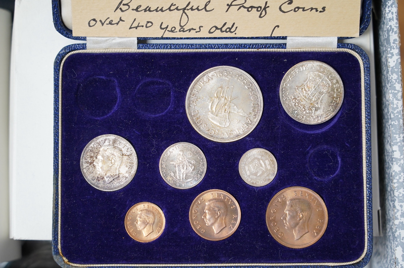 A large collection of Royal Mint boxed coins. Condition - fair